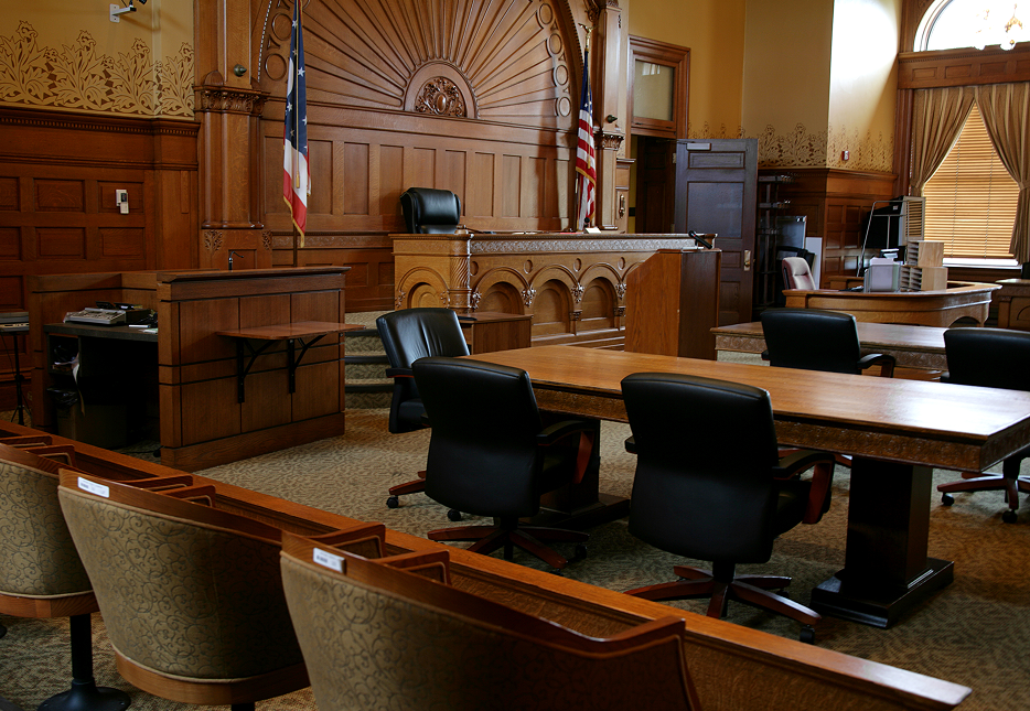 Traditional courtroom setup with flags