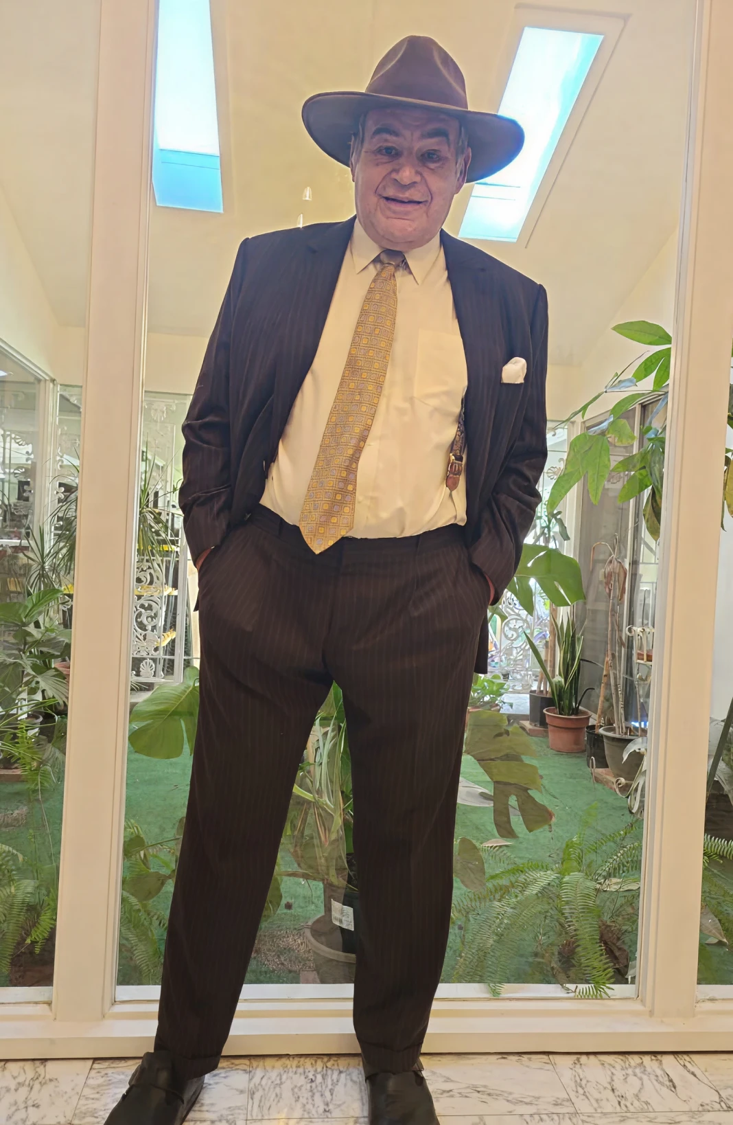 Elegant man standing in bright room