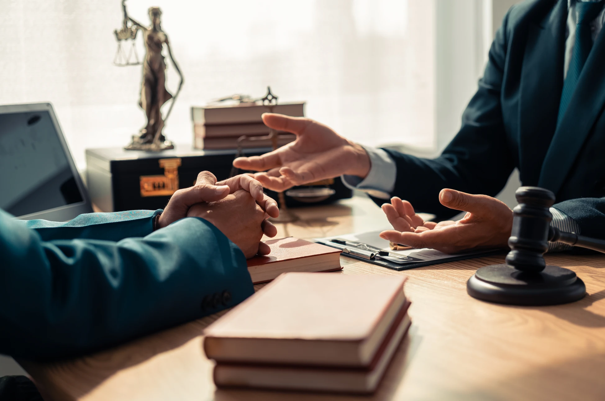 Hands gesturing during legal meeting