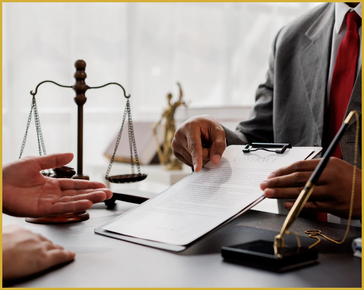 Lawyer reviewing contract with client